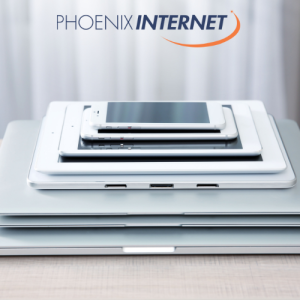 Stack of tablets and smartphones showcasing device setup, representing technology and mobile connectivity with the Phoenix Internet logo for reliable service. proper devices setup and reliable internet