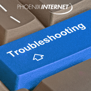 Close-up of a blue 'Troubleshooting' key on a keyboard, symbolizing tech support and problem-solving for internet issues, with the Phoenix Internet logo. proper devices setup and reliable internet